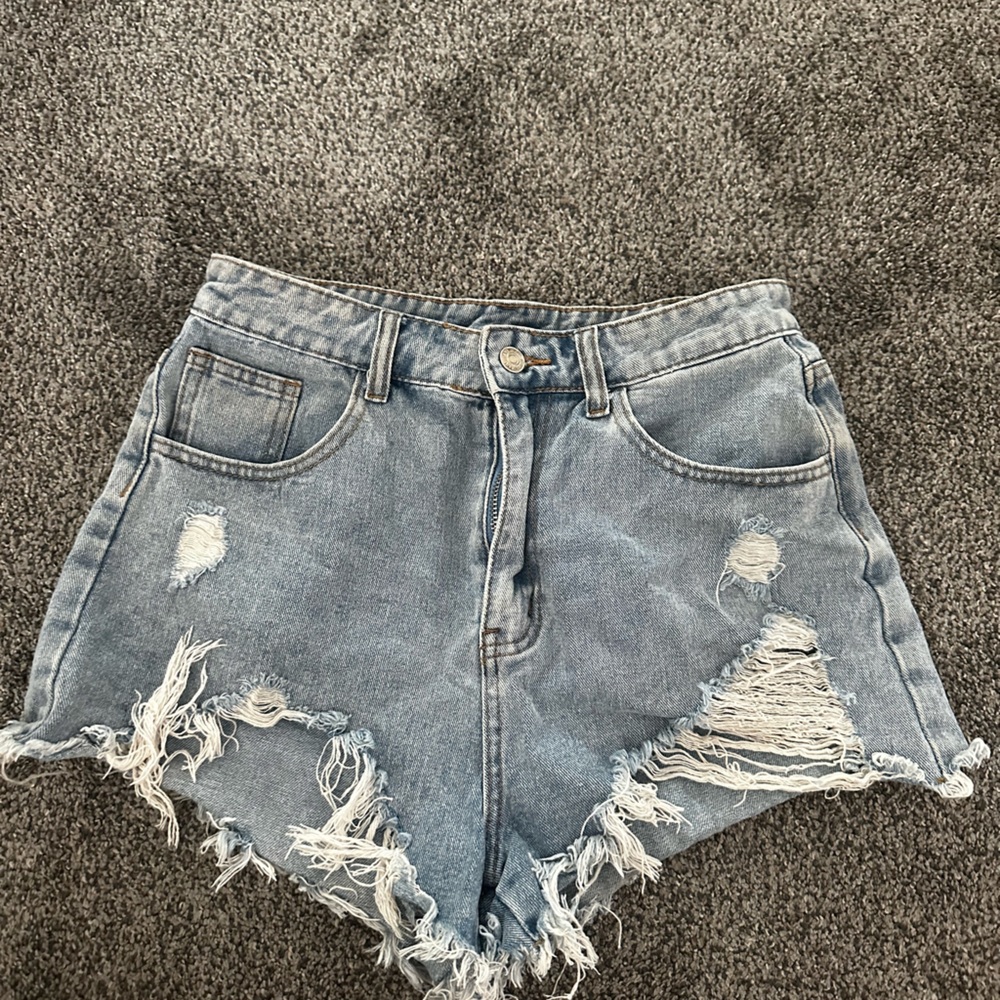 light wash blue jean shorts ripped